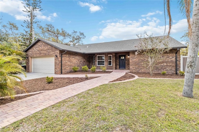 ranch-style home with brick siding, roof with shingles, a garage, driveway, and a front lawn