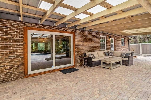 view of patio with outdoor lounge area and fence