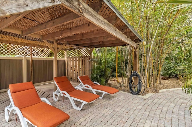 view of patio / terrace featuring fence and a pergola