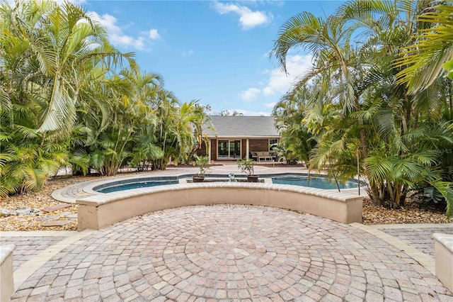 outdoor pool featuring a patio