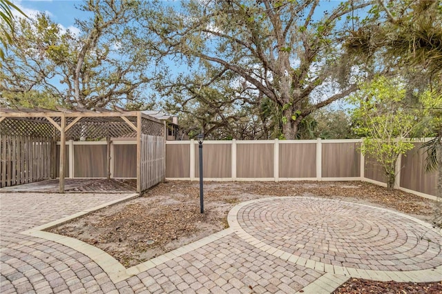 view of patio with a fenced backyard and a pergola