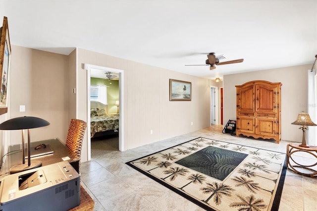 interior space featuring a ceiling fan, visible vents, and light tile patterned floors