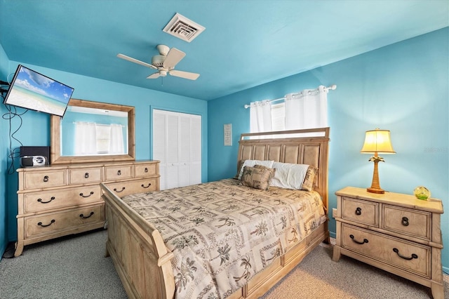 bedroom featuring ceiling fan, carpet floors, a closet, and visible vents