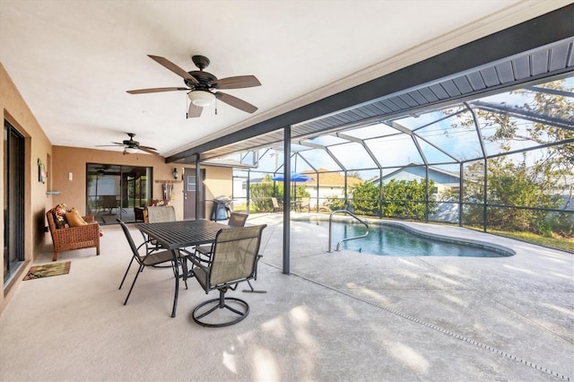 pool with glass enclosure, ceiling fan, and a patio