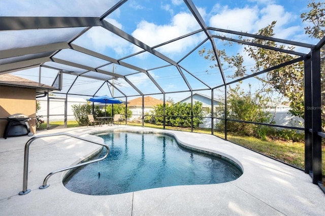 view of pool featuring a patio area, a lanai, and a fenced in pool