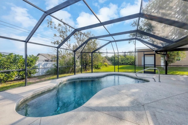 outdoor pool with a lanai, a patio area, and a yard