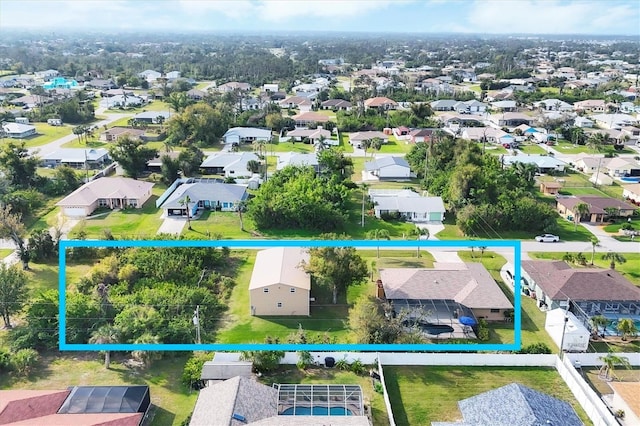 birds eye view of property with a residential view