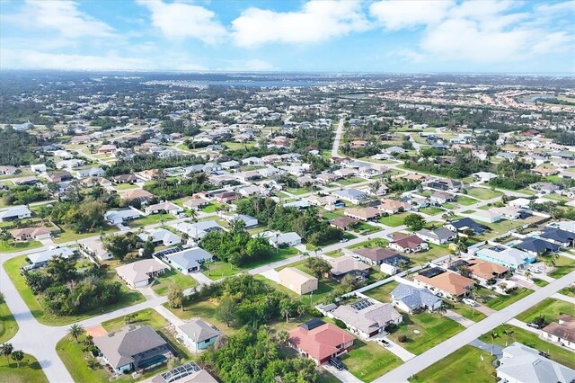 birds eye view of property with a residential view