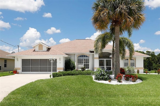 ranch-style house featuring concrete driveway, a front yard, and stucco siding