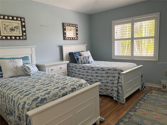 bedroom featuring dark wood-style floors