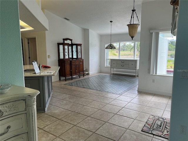 108 Fairway Rd, Rotonda West, FL 33947 - dining area featuring light tile patterned floors and baseboards