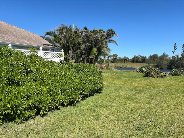 108 Fairway Rd, Rotonda West, FL 33947 - view of grassy yard featuring a water view