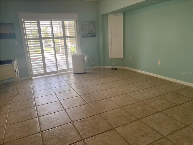 108 Fairway Rd, Rotonda West, FL 33947 - empty room featuring light tile patterned floors and baseboards