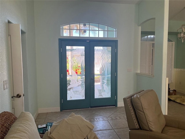 108 Fairway Rd, Rotonda West, FL 33947 - tiled entrance foyer featuring french doors and arched walkways