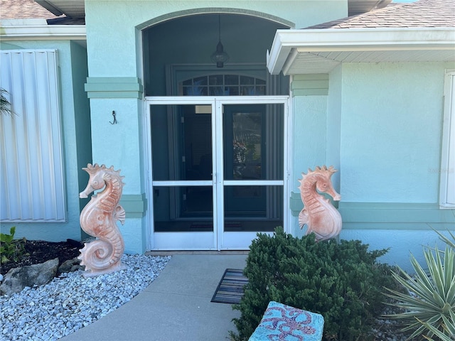 108 Fairway Rd, Rotonda West, FL 33947 - doorway to property with stucco siding
