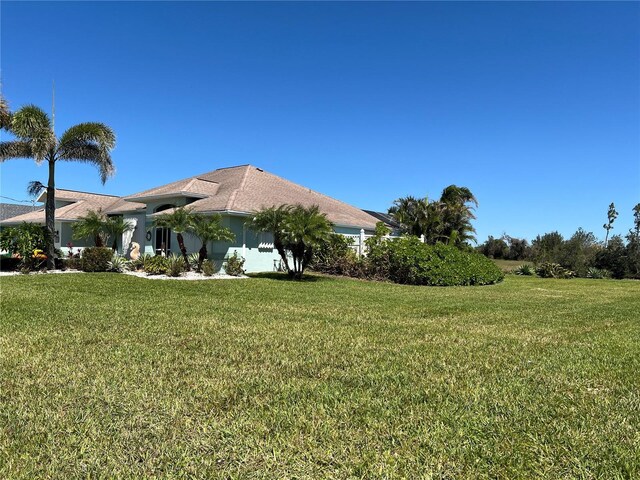 108 Fairway Rd, Rotonda West, FL 33947 - view of green lawn