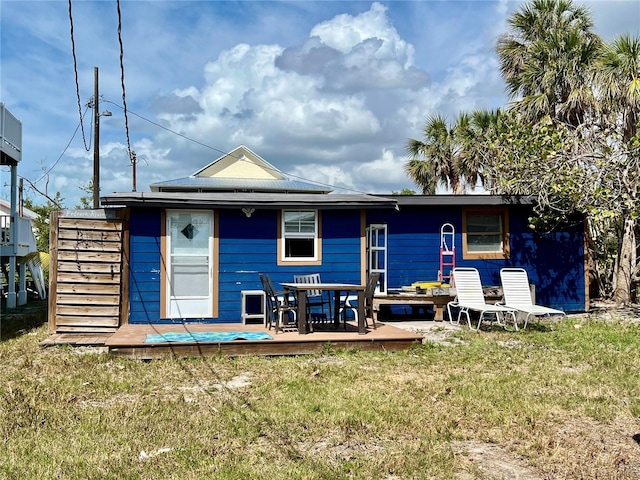 back of house with a yard