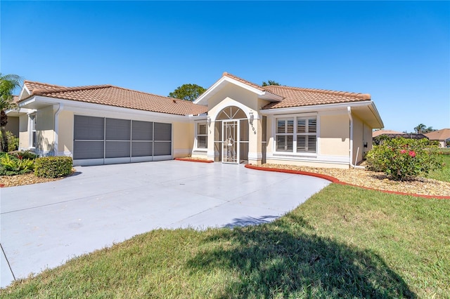 mediterranean / spanish-style home featuring a garage, a tiled roof, and stucco siding