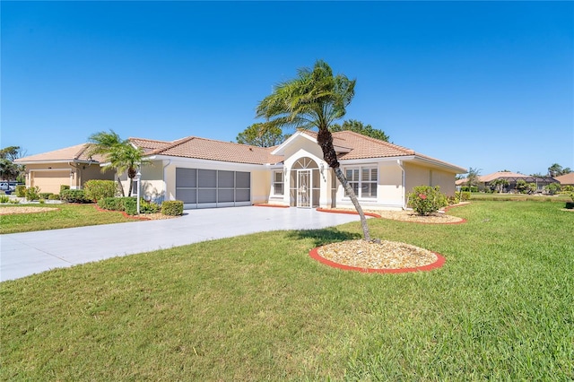 view of front of home with driveway, an attached garage, a front lawn, and stucco siding