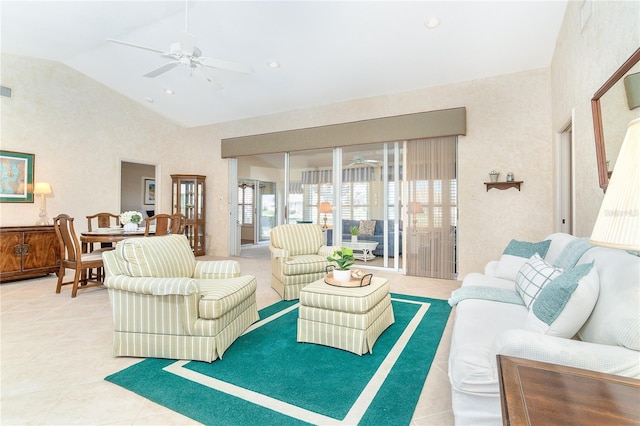 living room with light tile patterned floors, ceiling fan, high vaulted ceiling, and recessed lighting