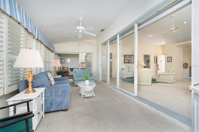 sunroom with vaulted ceiling, ceiling fan, and visible vents