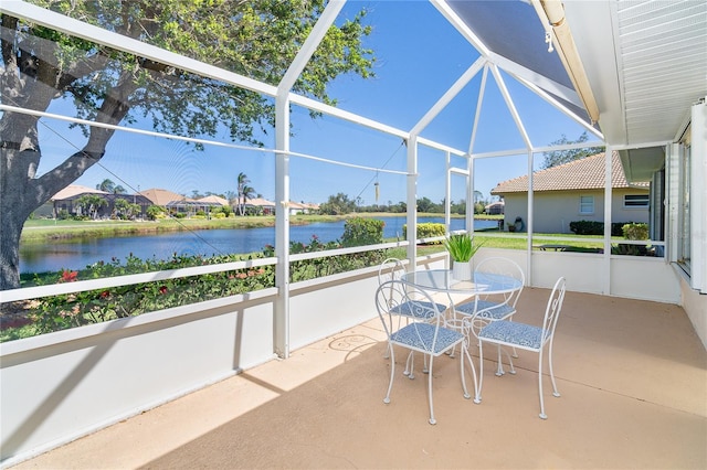 unfurnished sunroom with a water view