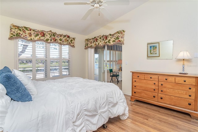 bedroom with vaulted ceiling, access to outside, light wood-type flooring, and a ceiling fan