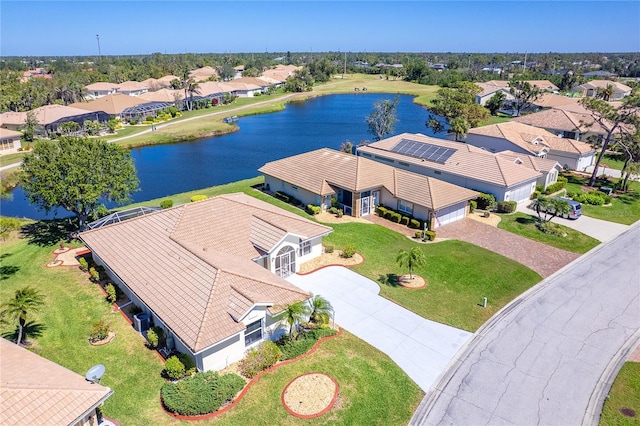 bird's eye view featuring a water view and a residential view