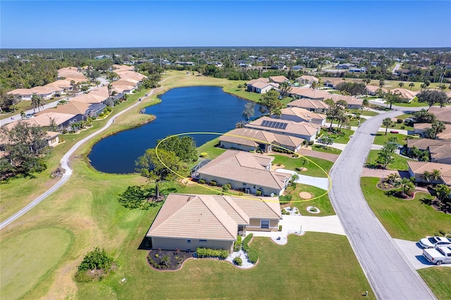 drone / aerial view featuring a water view and a residential view