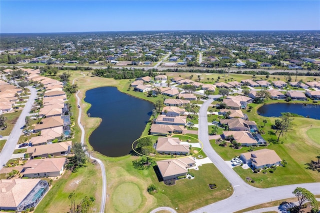 aerial view with a residential view, a water view, and golf course view