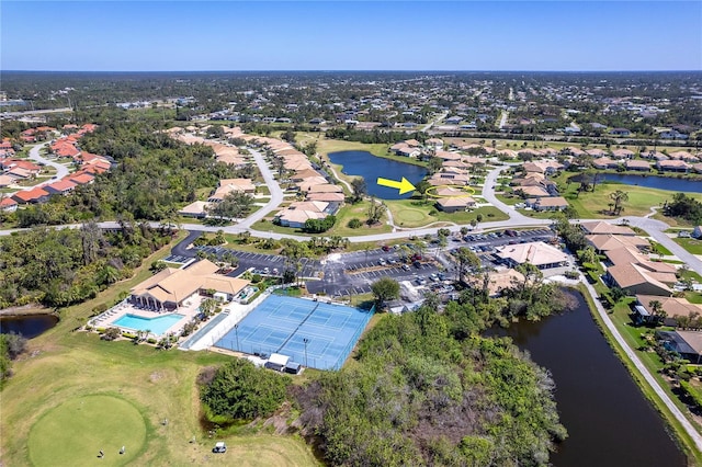 birds eye view of property featuring a residential view, view of golf course, and a water view