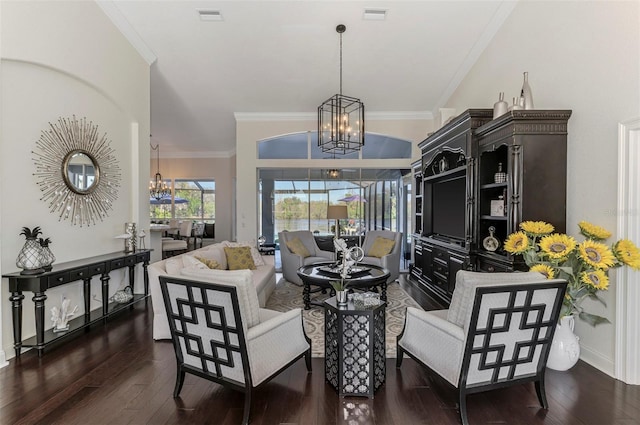 interior space with wood finished floors, visible vents, crown molding, and an inviting chandelier