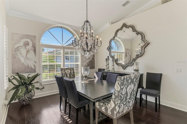 dining space with hardwood / wood-style flooring, baseboards, visible vents, and crown molding