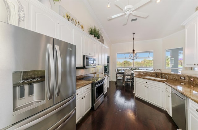 kitchen featuring stainless steel appliances, white cabinets, and a sink