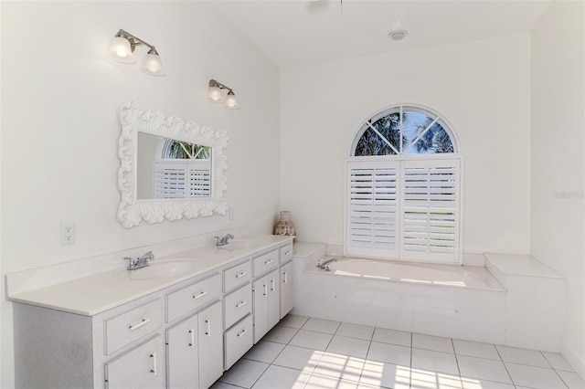 full bathroom with tile patterned flooring, a garden tub, a sink, and double vanity