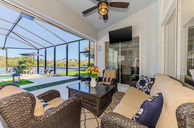 view of patio featuring ceiling fan, glass enclosure, outdoor lounge area, and an outdoor pool