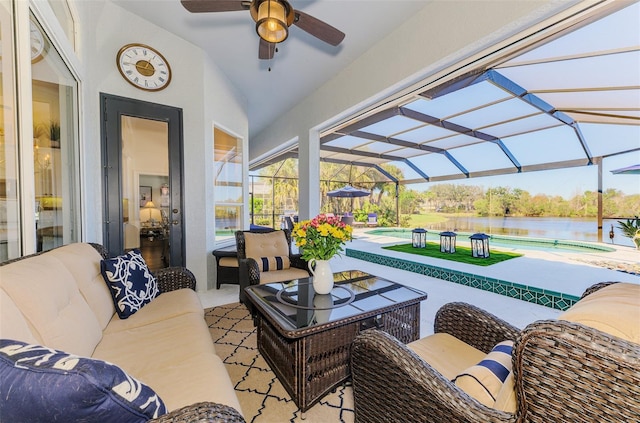 view of patio featuring a water view, a ceiling fan, glass enclosure, an outdoor pool, and an outdoor living space