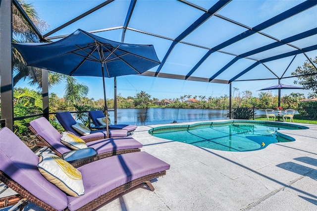 pool featuring a patio, a water view, and glass enclosure