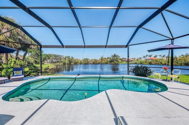 pool with a water view, glass enclosure, and a patio