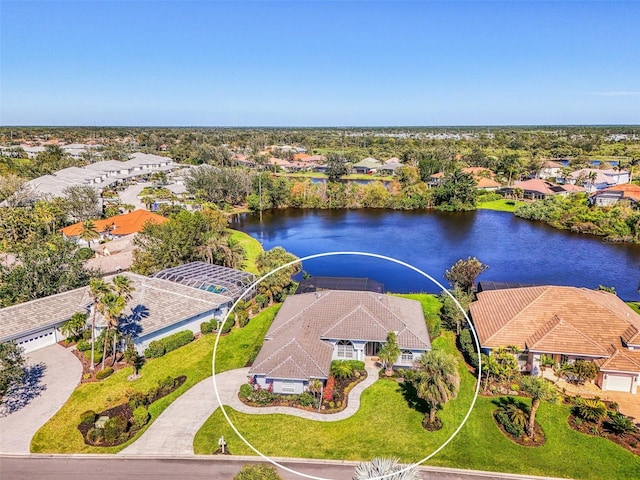 drone / aerial view with a water view and a residential view