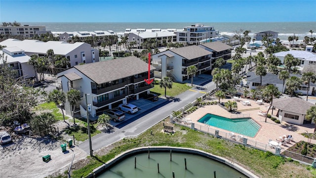 birds eye view of property with a residential view and a water view