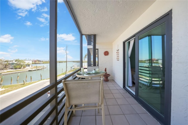 balcony featuring a water view