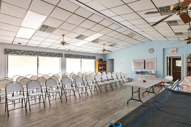 dining area with visible vents, a drop ceiling, ceiling fan, and wood finished floors