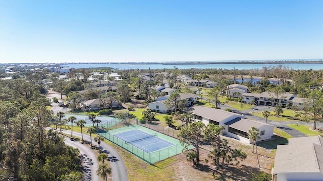 drone / aerial view featuring a residential view and a water view