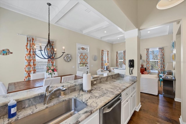 kitchen with white cabinets, dishwasher, dark wood-type flooring, light stone countertops, and beam ceiling