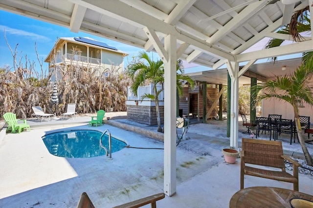 outdoor pool featuring outdoor dining space, stairs, and a patio