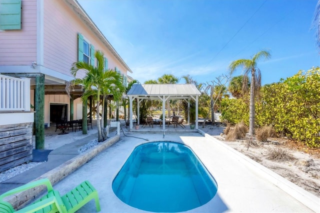 pool featuring a patio area and a gazebo