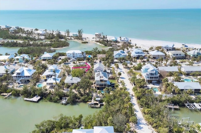 drone / aerial view featuring a residential view and a water view