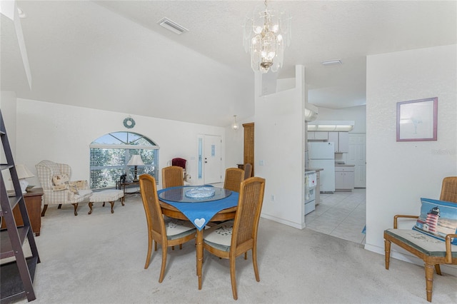 dining area featuring lofted ceiling, a notable chandelier, visible vents, and light carpet