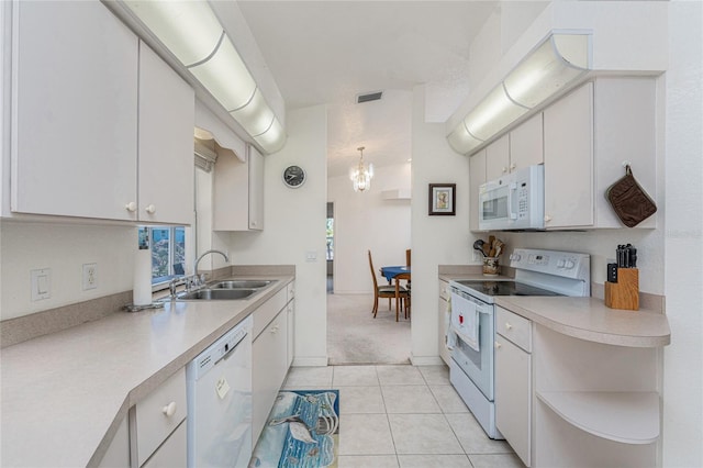 kitchen with a sink, light countertops, white cabinets, white appliances, and open shelves